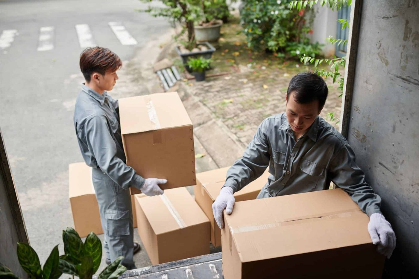 Workers loading boxes for delivery