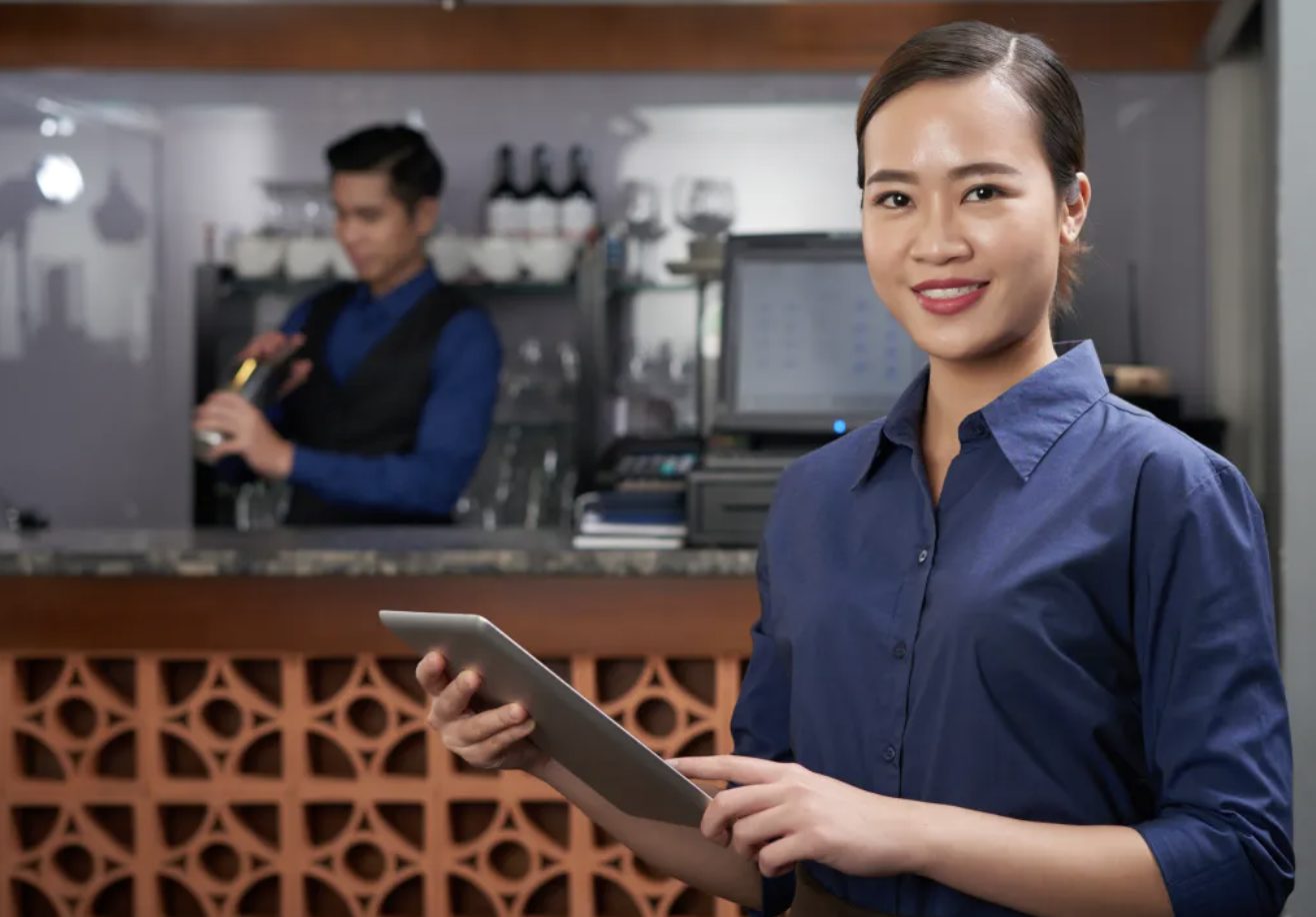 Restaurant service crew with a tablet